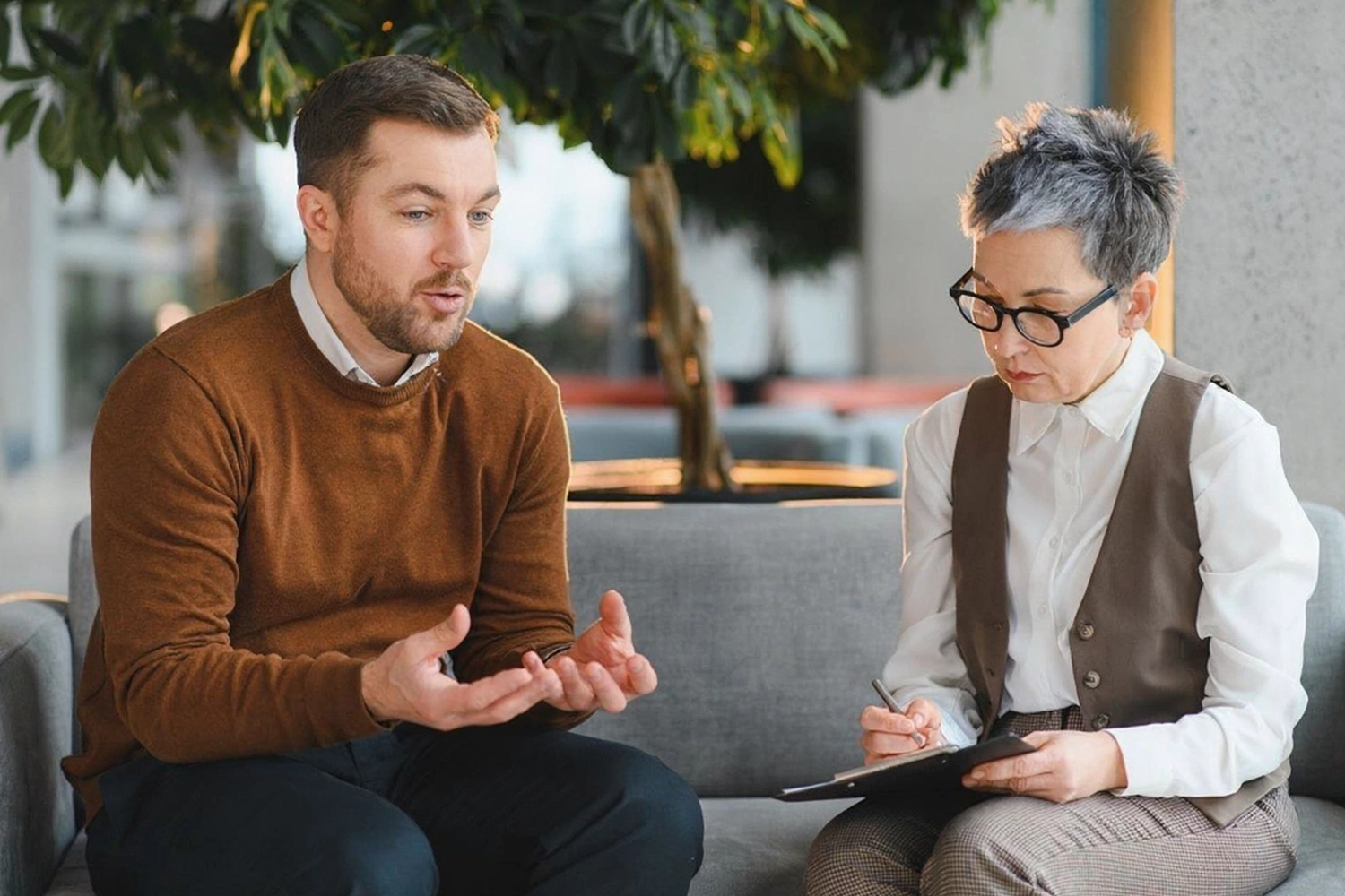 Clinician and patient during a one-to-one psychiatric consultation